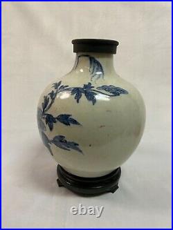 Chinese blue & white floral design crackled porcelain vase. H 10 inch W 8 inch
