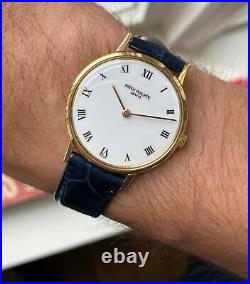 Patek Philippe 18K Yellow Gold 90s White Porcelain Roman Numeral Dial Watch